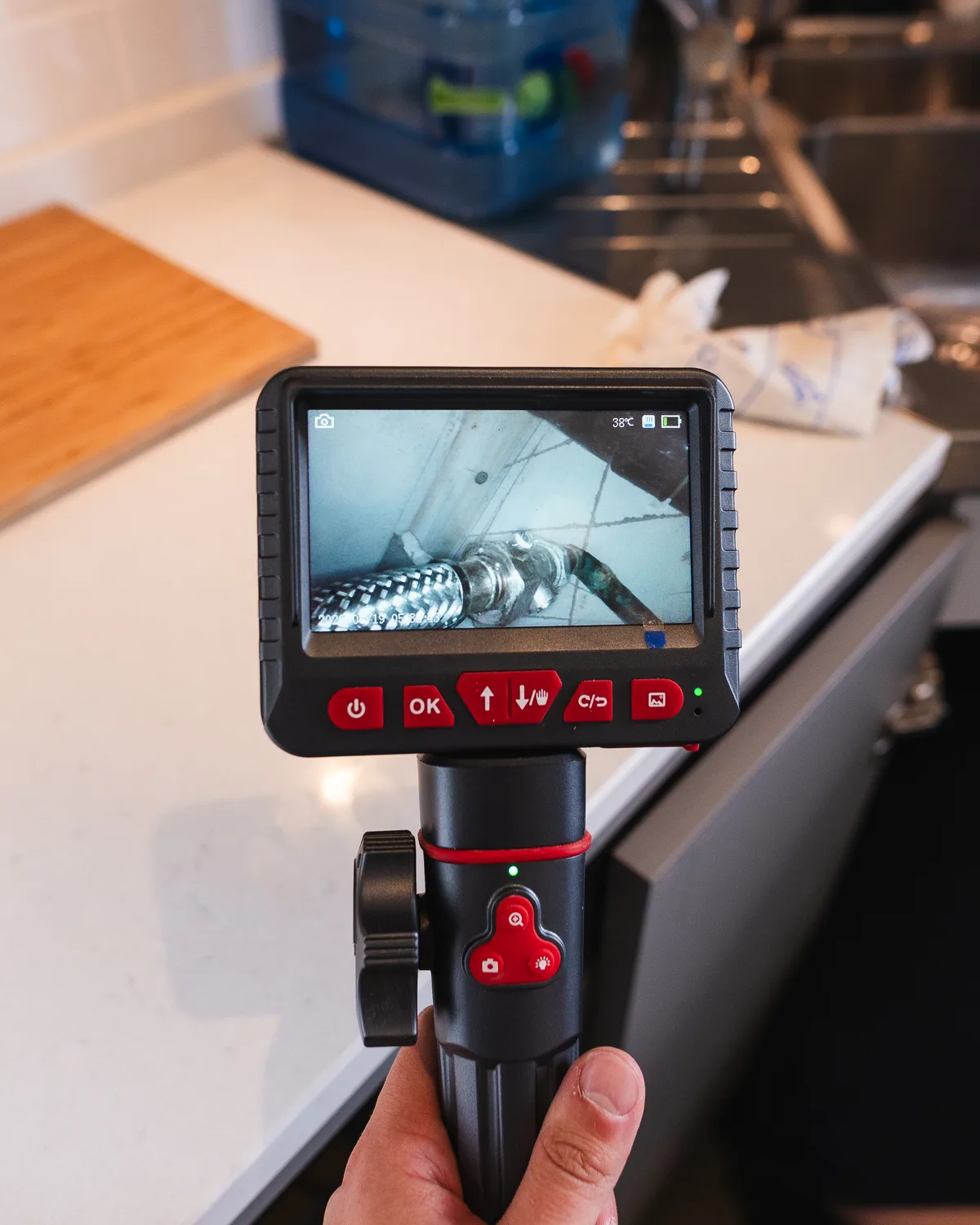Inspection camera screen showing concealed pipework